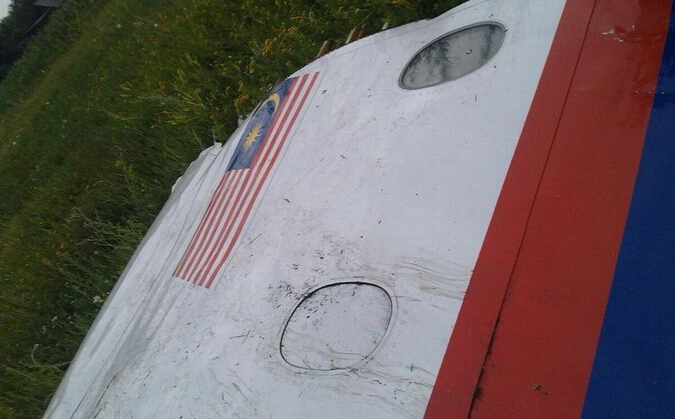 马航MH17在乌坠机现场残骸图片-重庆旅行社